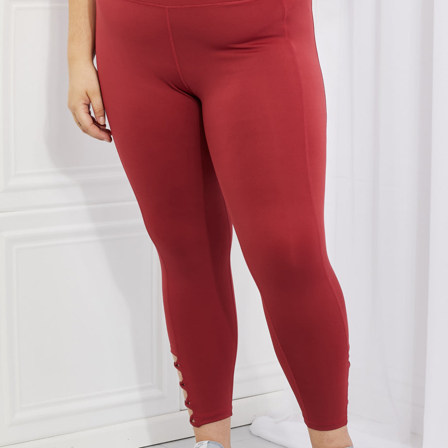 Yelete Ready For Action Full Size Ankle Cutout Active Leggings in Brick Red